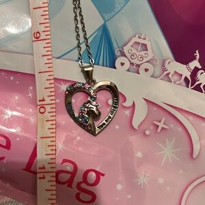 NWT - Unicorn heart necklace and Disney princess surprise bag.